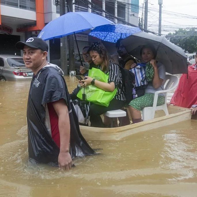 Fierce storm blows out of northern Philippines after leaving 14 dead in landslides and floods
